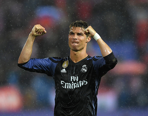 Cristiano Ronaldo celebrates Real Madrid qualification to the Champions League final in a rainy night at the Vicente Calderón