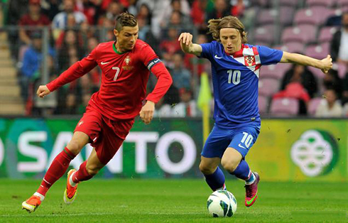 Cristiano Ronaldo and Luka Modric, playing against each other in Portugal vs Croatia, in a friendly in 2013
