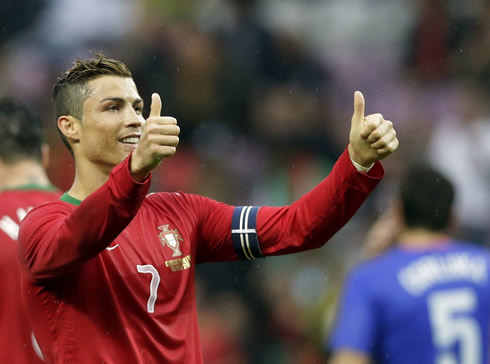 Cristiano Ronaldo raises his two thumbs as a sign of approval, after having scored for Portugal against Croatia, in 2013