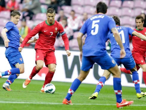 Cristiano Ronaldo trying to get past three Croatian defenders, in a friendly match between Portugal and Croatia in 2013