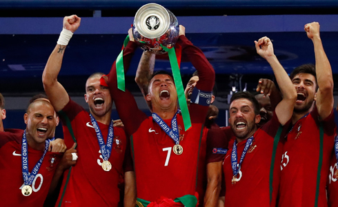 Cristiano Ronaldo lifting the EURO 2016 trophy for Portugal