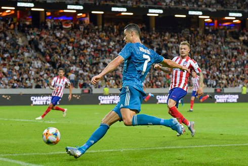 Cristiano Ronaldo running down the wing to put in a cross with his left foot