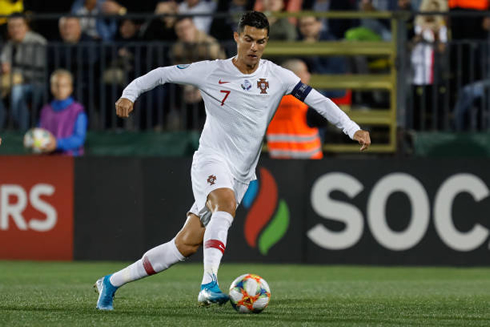 Cristiano Ronaldo moving the ball forward in a Portugal match