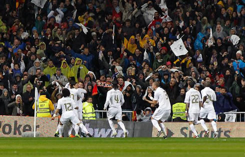 Marcelo, Ozil, Cristiano Ronaldo, Sergio Ramos, Pepe, Xabi Alonso and Lass Diarra celebrate Real Madrid goal against Barcelona in the Santiago Bernabéu
