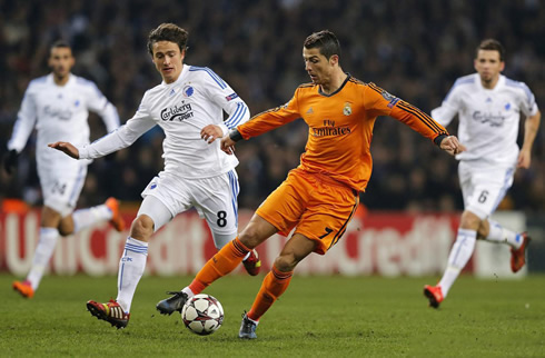 Cristiano Ronaldo protecting the ball from a Copenhagen defender