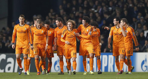 Real Madrid players all grouped, walking towards their own half