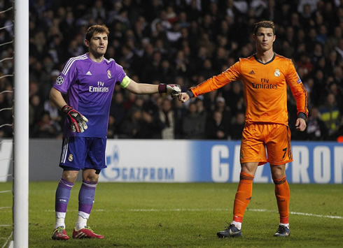 Cristiano Ronaldo touching hands with Iker Casillas