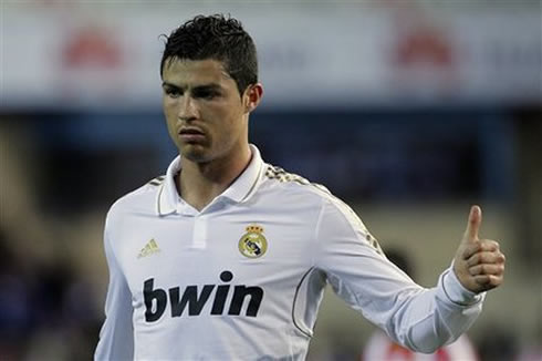 Cristiano Ronaldo shows his agreement gesture with his thumb turned up, in a Real Madrid match in 2012