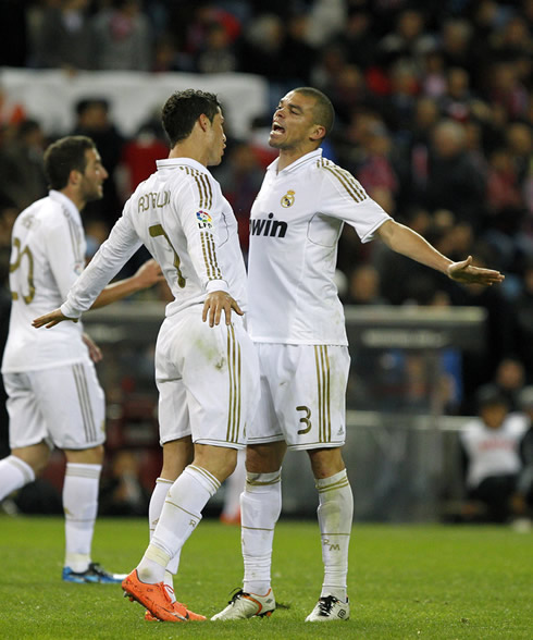 Cristiano Ronaldo and Pepe celebrating goal in NBA style, by jumping and hitting each other with the chest