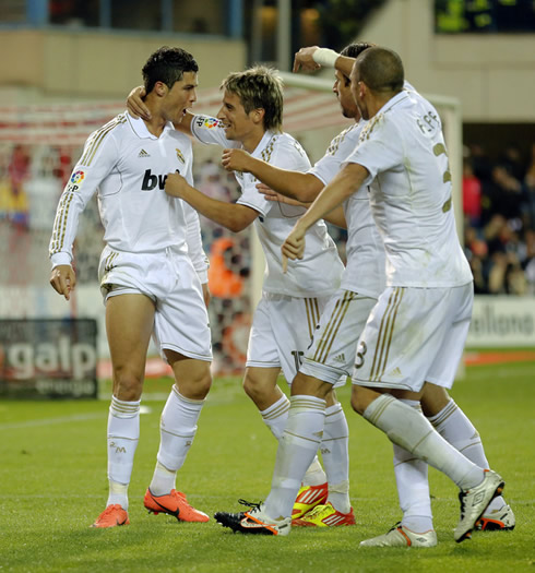 Real Madrid players congratulating Cristiano Ronaldo after his amazing dip shot goal against Atletico Madrid