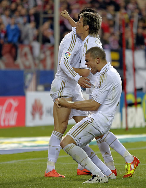 Cristiano Ronaldo hugging Fábio Coentrão, while Pepe shows all his joy to the crowd at the Vicente Calderón