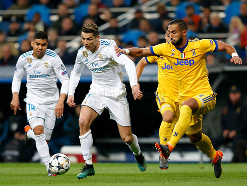 Cristiano Ronaldo dribbling an opponent in Real Madrid vs Juventus in 2018