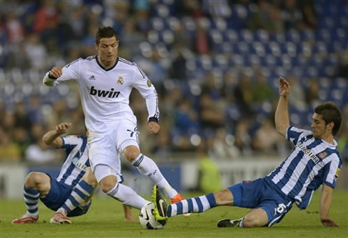 Cristiano Ronaldo getting past two Espanyol defenders, in one of the last fixtures for La Liga in 2013