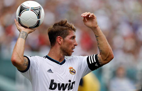 Sergio Ramos holding the ball on his hand and showing off his new haircut and hairstyle for 2012-2013, as well as his right arm tatoo