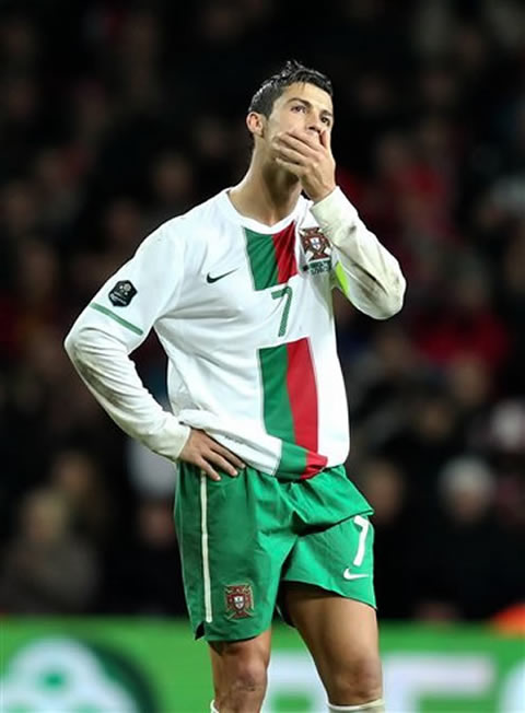 Cristiano Ronaldo with his hand on his chin, looking worried about Portugal's hopes and future in the EURO 2012