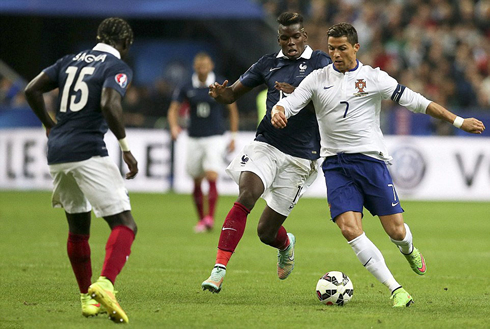 Cristiano Ronaldo guarding the ball from Paul Pogba, in France vs Portugal