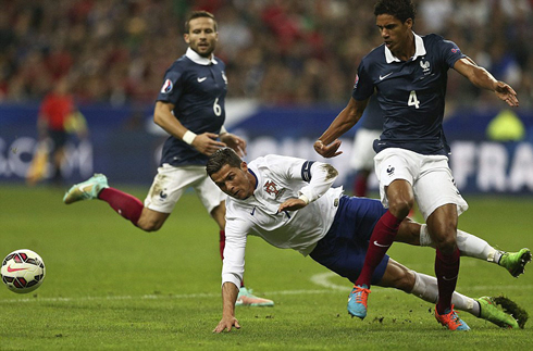 Cristiano Ronaldo disputing the ball with Raphael Varane, in a friendly international between France and Portugal in 2014