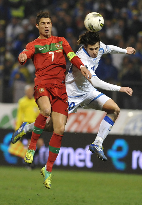 Cristiano Ronaldo jumps high to head the ball, against Bosnia-Herzegovina, in EURO 2012 playoff round