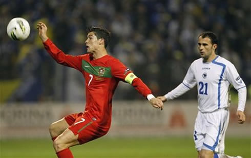 Cristiano Ronaldo losing his balance while the ball approaches him