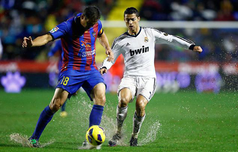 Cristiano Ronaldo sliding in a heavy pitch during a rainy weather, in Levante vs Real Madrid for the Spanish League 2012-2013