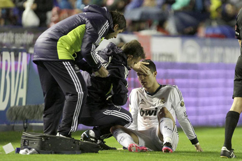 Cristiano Ronaldo being treated by Real Madrid medical staff on the sideline, in Levante vs Real Madrid for La Liga 2012-2013