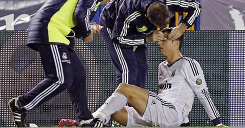 Cristiano Ronaldo being stitched on the pitch, after taking an elbow right above his left eye, in Levante vs Real Madrid for La Liga 2012-2013