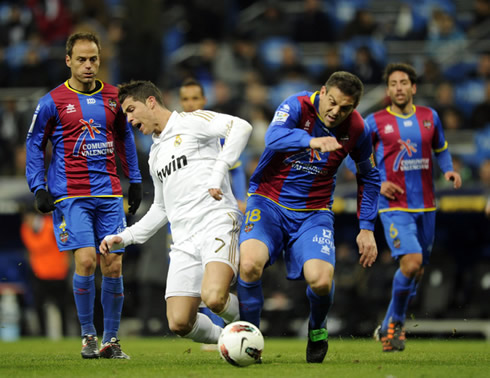 Cristiano Ronaldo gets tackled by Ballesteros, in Real Madrid vs Levante, in 2012
