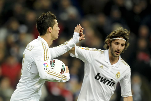 Cristiano Ronaldo touches hands with Esteban Granero, as Real Madrid scored another against Levante, for La Liga