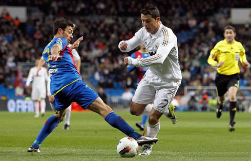 Cristiano Ronaldo dribbling and being tripped by a Levante defender in La Liga 2012