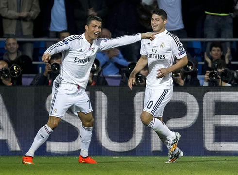 Cristiano Ronaldo pointing to James Rodríguez after scoring for Real Madrid