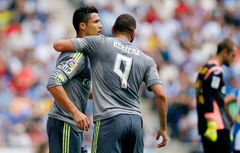 Cristiano Ronaldo receiving a hug from Karim Benzema