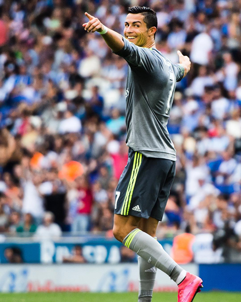 Cristiano Ronaldo looks behind and smiles to his teammates