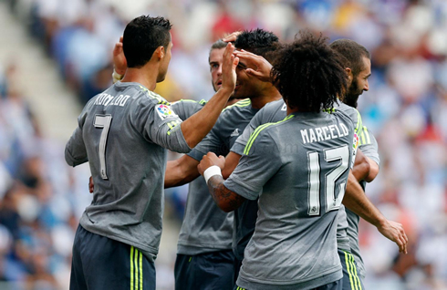 Cristiano Ronaldo is congratulated by his Real Madrid teammates