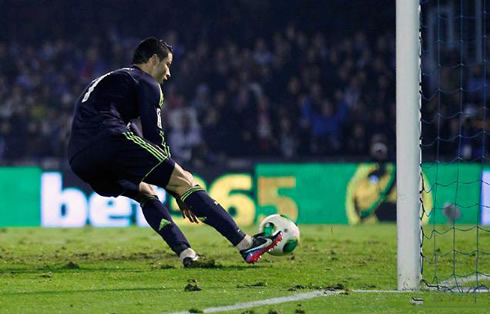 Cristiano Ronaldo getting the ball into his hand to head back to his half and still try to win the game for Real Madrid, in the Copa del Rey 2012-2013