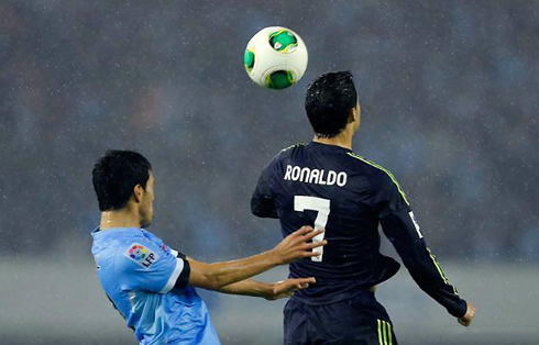 Cristiano Ronaldo jumping higher than a Celta de Vigo defender, in a game for Real Madrid in 2012-2013