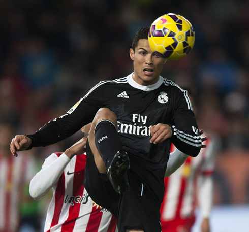 Cristiano Ronaldo preparing to control a high ball