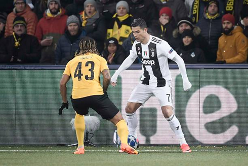 Cristiano Ronaldo staring in front of a defender in a Champions League game