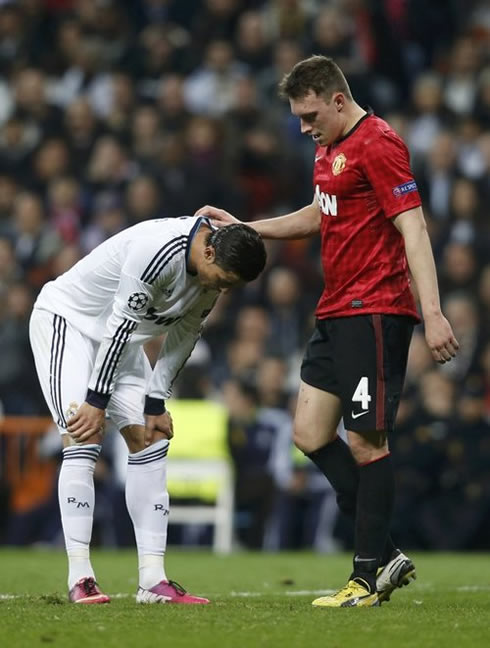 Cristiano Ronaldo being comforted by Phil Jones, during the Real Madrid vs Manchester United game for the Champions League 2013 first leg