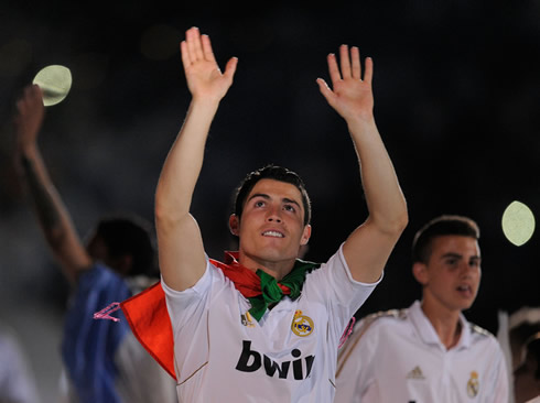 Cristiano Ronaldo thanking Real Madrid fans and supporters on the Santiago Bernabéu crowd and wearing the Portuguese flag
