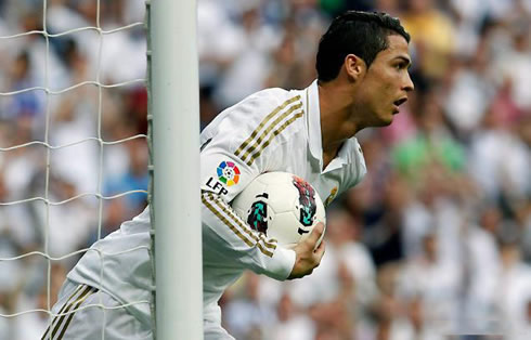 Cristiano Ronaldo quickly picking the ball and returning to his half of the pitch after another goal for Real Madrid, in order for the game to restart as soon as possible