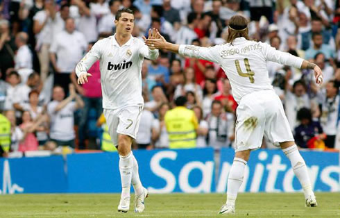 Cristiano Ronaldo touching hands with Sergio Ramos, after scoring a goal for Real Madrid