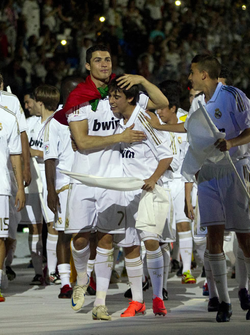 Cristiano Ronaldo showing his tender and affective side, holding a young kid from Real Madrid cantera in the league celebrations at the Santiago Bernabéu, in 2012