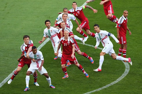 Cristiano Ronaldo moving between Denmark defensive lines, just when a free-kick is about to be taken in the EURO 2012