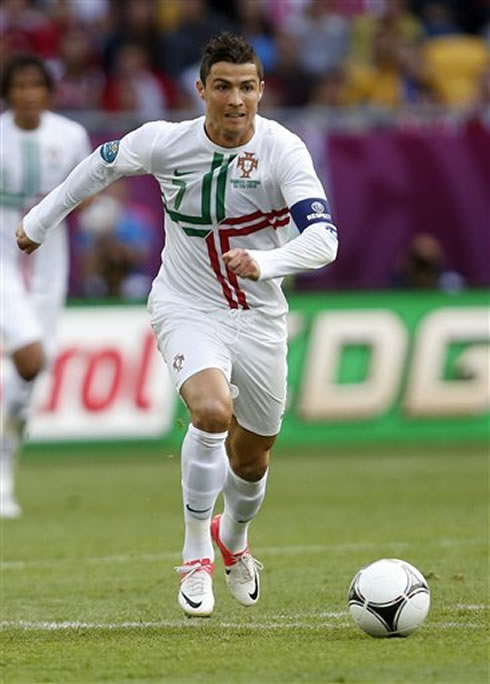 Cristiano Ronaldo chasing the ball during a match between Portugal and the Danish National Team, for the EURO 2012