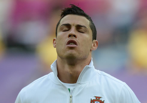 Cristiano Ronaldo closing his eyes and concentrating during the Portuguese anthem right before the game between Portugal and Denmark for the EURO 2012
