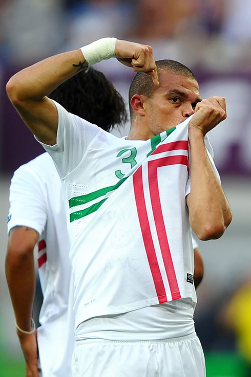 Pepe kissing the Portuguese National Team badge/symbol on his jersey, and showing his love for the country after scoring the opening goal in Portugal vs Denmark for the EURO 2012