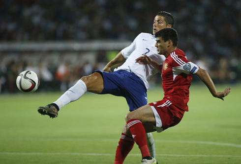 Cristiano Ronaldo reaches out to the ball before the Armenian defender and goalkeeper, to put Portugal on the lead