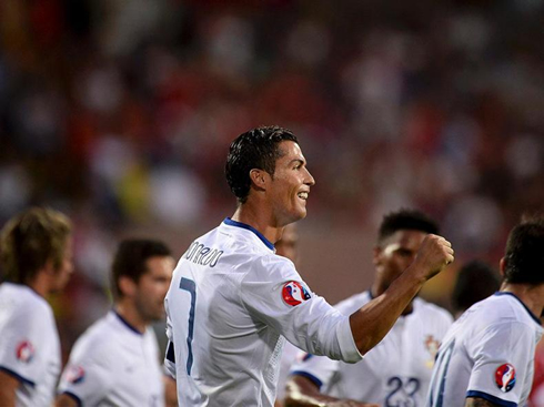 Cristiano Ronaldo puts on a smile as he celebrates his goal and hat-trick for Portugal