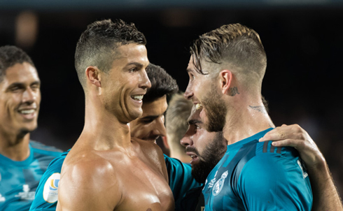 Cristiano Ronaldo and Sergio Ramos smile at each other after Real Madrid takes the lead in El Clasico at the Camp Nou