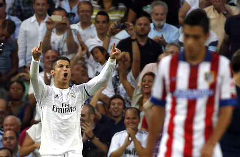 Cristiano Ronaldo raising his two fingers up in the air, right after he scored the equalizer in the derby Real Madrid vs Atletico Madrid at the Bernabéu